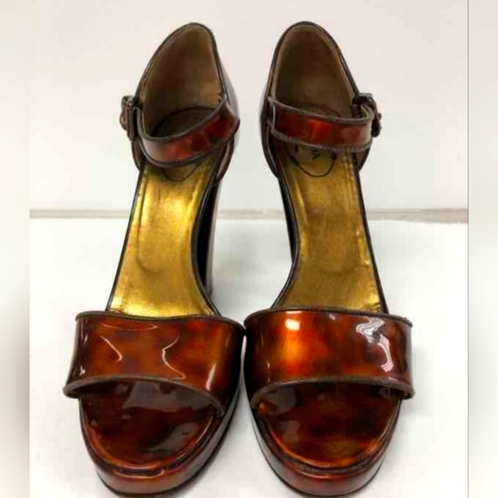 Prada tortoise patent leather pumps
